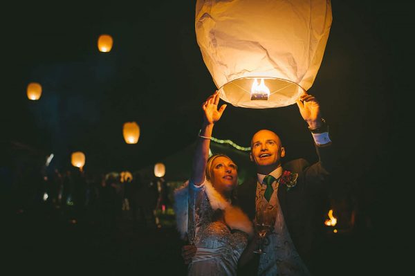 Bride and groom releasing a lantern by Abi Riley Photography