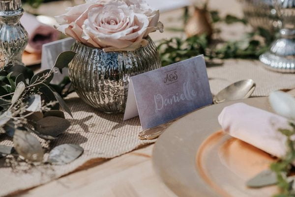 A photograph of wedding stationery - a table setting. A unique wedding stationery design