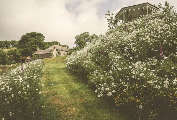 A photograph of a manor, a laid-back manor wedding