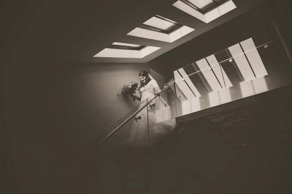 Bride walking down steps by Tracey Warbey Photography