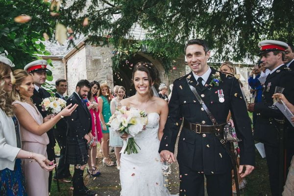 Newly weds leaving church as Mr and Mrs, a romantic Cornish wedding