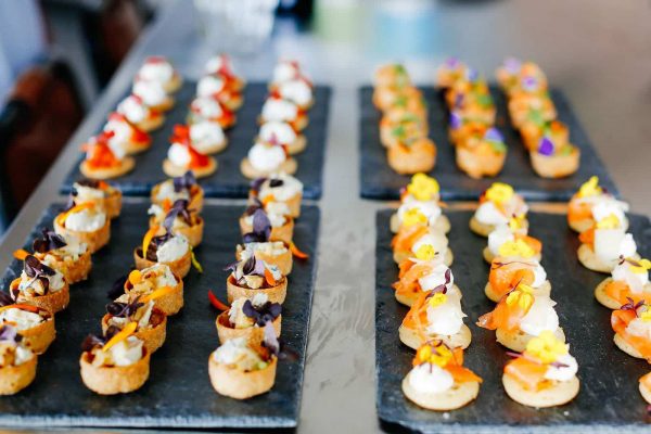 Delicious canapes on a slate plate by Indulgence catering as featured on eeek! weddings