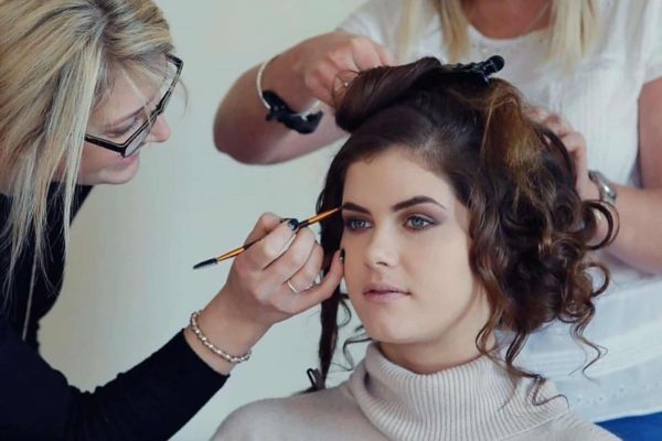 Makeup artist Stacey Cremin applying makeup to a bride to be. Stacey Cremin Makeup as featured on eeek! weddings