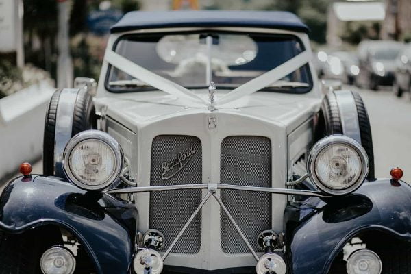A photograph of a wedding car. Add glamour, style and sheer flamboyance to your day by arriving in style with Treverbyn Cars