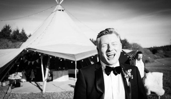 Groom laughing by Verity Westcott Photography
