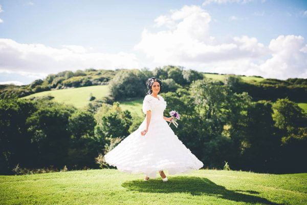 A photograph of a bride dancing in a beautiful wedding dress