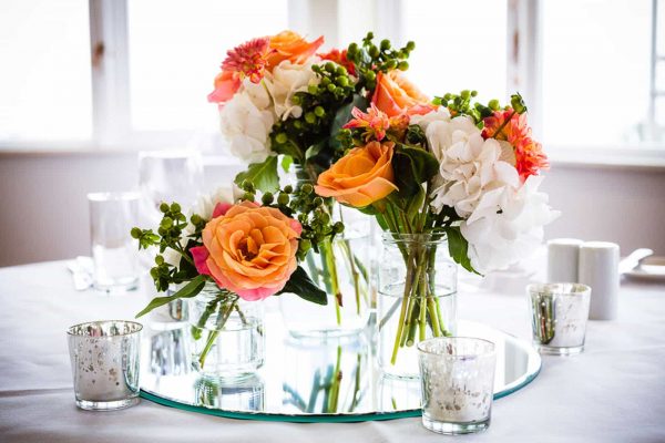 A photograph of beautiful orange wedding flowers from a small, innovative, designer florist