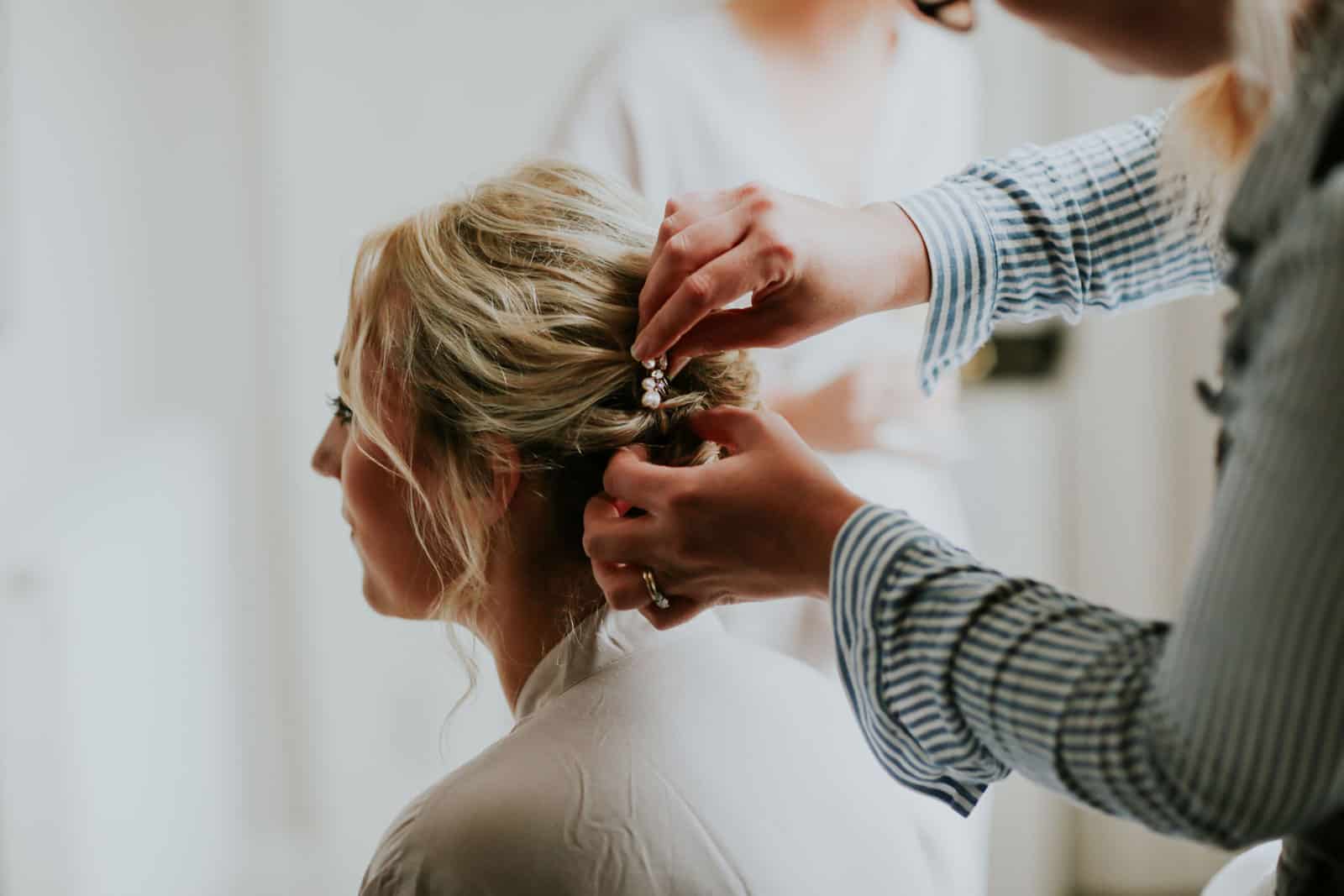  Bridesmaid having her hair professionally styled  - Get Married in Cornwall with eeek!